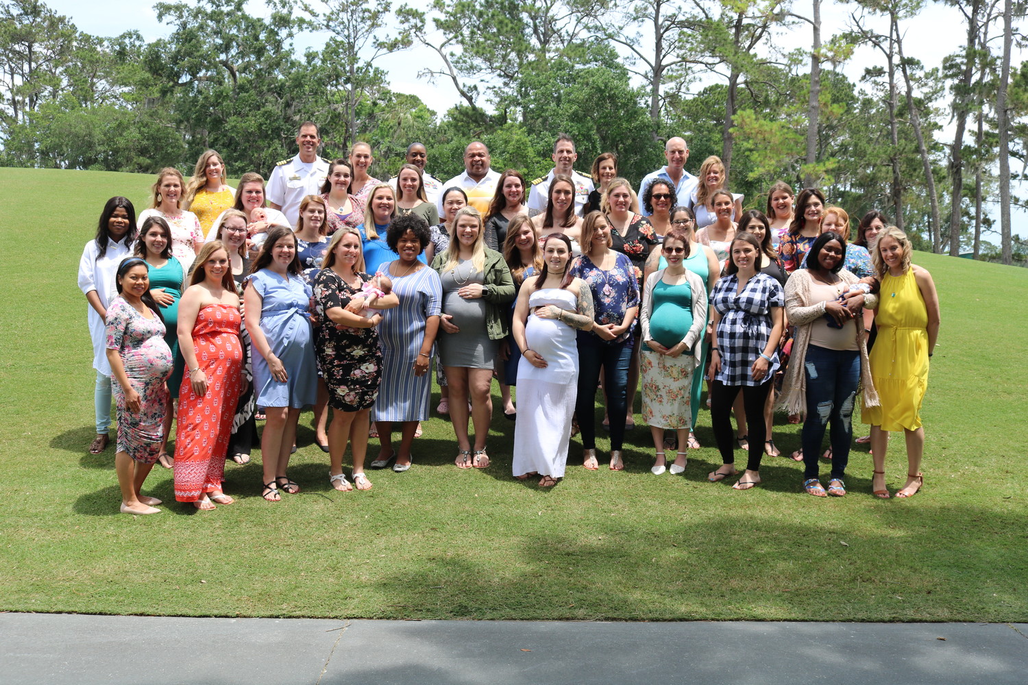 Military moms-to-be and other attendees of Operation Shower gather following a fun afternoon filled with gifts and games at TPC Sawgrass on Sunday, May 6.